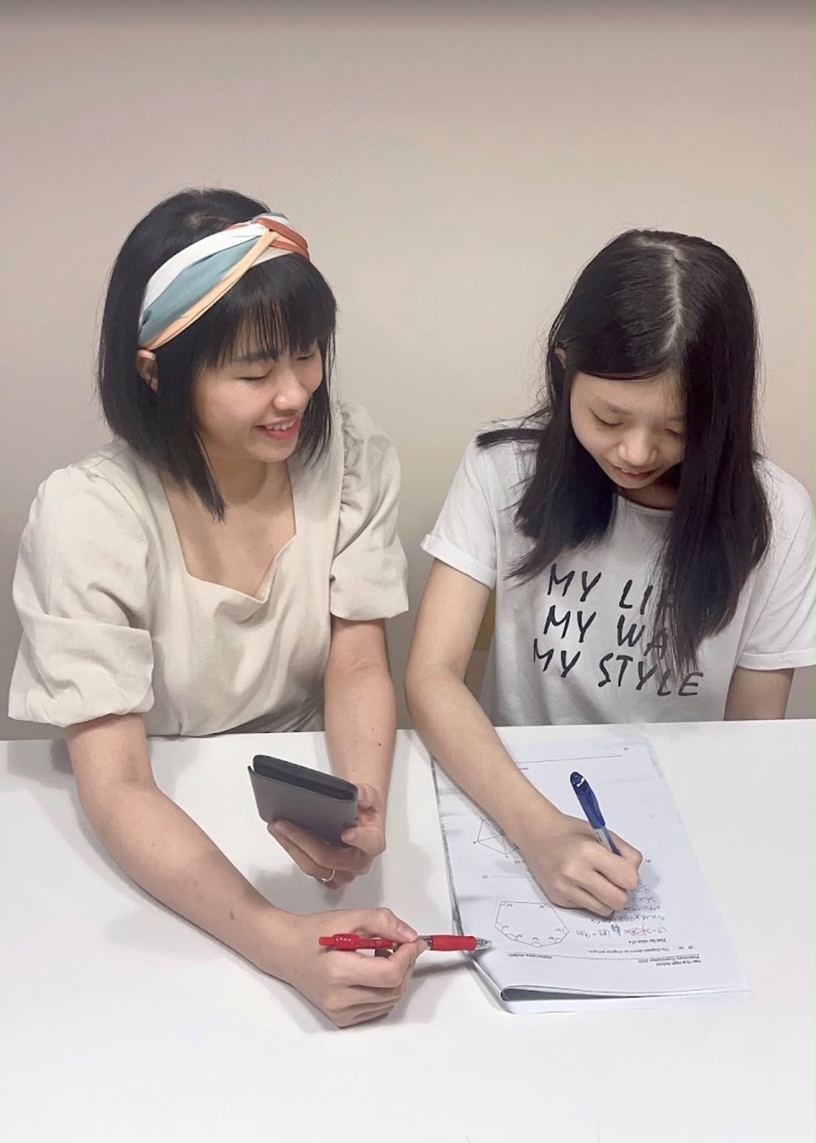 May guiding a student through a maths worksheet